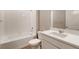 Bathroom features tub, shower combination, single sink with white countertop at 18336 Prince Hill Cir, Parker, CO 80134