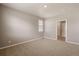 This bedroom has neutral paint, carpet flooring and a window providing natural light at 18336 Prince Hill Cir, Parker, CO 80134