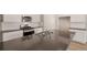 Kitchen boasts an island with sink, stainless steel appliances, white subway tile and white cabinets at 18336 Prince Hill Cir, Parker, CO 80134