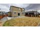 Lush backyard featuring a well maintained lawn, stone landscaping and a glimpse of a patio at 5686 Eagle River Pl, Brighton, CO 80601