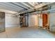 Spacious unfinished basement with exposed ceiling and visible utilities offers customization potential at 5686 Eagle River Pl, Brighton, CO 80601