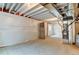 Unfinished basement with exposed ceiling and concrete floor, ready for your personal touch at 5686 Eagle River Pl, Brighton, CO 80601