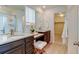 Elegant bathroom with double vanity, granite counters, and walk-in shower at 5686 Eagle River Pl, Brighton, CO 80601