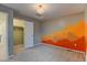 Bedroom with decorative mountain accent wall and an open closet at 5686 Eagle River Pl, Brighton, CO 80601