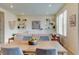 Bright and airy dining area with modern decor, including open shelves and decorative wall art at 5686 Eagle River Pl, Brighton, CO 80601