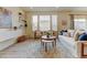 Living room boasts a neutral color palette, bright light, and modern decor with floating shelves for a modern look at 5686 Eagle River Pl, Brighton, CO 80601