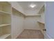 A spacious walk-in closet with shelves and racks for ample storage at 5686 Eagle River Pl, Brighton, CO 80601