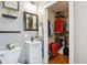 Functional bathroom with a pedestal sink, closet, and ample storage space at 6055 E Minnesota Dr, Denver, CO 80224