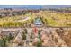 An aerial view shows a luxury home near a golf course with mountain views in the background at 106 S University Blvd # 2, Denver, CO 80209