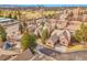 An aerial view showcases well-manicured residential architecture and mature landscaping at 106 S University Blvd # 2, Denver, CO 80209