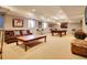 Spacious basement featuring a seating area, pool table, modern lighting, and carpeted floors at 106 S University Blvd # 2, Denver, CO 80209
