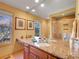 Bathroom featuring dual sinks with granite countertop, framed art, with a shower in the background at 106 S University Blvd # 2, Denver, CO 80209