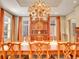 Formal dining area with a large wooden table, ornate hutch, and elegant chandelier at 106 S University Blvd # 2, Denver, CO 80209