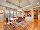 Well-lit dining area with a view into the kitchen and access to the outdoor patio at 106 S University Blvd # 2, Denver, CO 80209