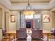 Bright dining room with a unique chandelier and ample natural light at 106 S University Blvd # 2, Denver, CO 80209