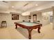 Basement game room with a pool table, modern pendant lighting, and carpeted flooring at 106 S University Blvd # 2, Denver, CO 80209
