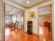 Hallway view featuring an elegant art display, hardwood floors, and decorative trim at 106 S University Blvd # 2, Denver, CO 80209
