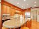 Gourmet kitchen featuring a center island, stainless steel appliances, and custom wood cabinets at 106 S University Blvd # 2, Denver, CO 80209