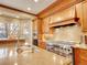 Gourmet kitchen featuring stainless steel appliances, custom cabinets and granite countertops at 106 S University Blvd # 2, Denver, CO 80209
