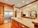 Open concept kitchen featuring stainless steel appliances, granite counters, and custom wood cabinets at 106 S University Blvd # 2, Denver, CO 80209