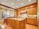 Spacious kitchen featuring custom wood cabinets, stainless steel appliances and a center island at 106 S University Blvd # 2, Denver, CO 80209