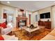 Inviting living room with a fireplace, plush seating, and a view to other rooms at 106 S University Blvd # 2, Denver, CO 80209