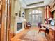 Cozy home office with a fireplace, built-in desk, and ample natural light at 106 S University Blvd # 2, Denver, CO 80209