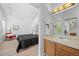 Open concept bathroom leading into bedroom, featuring neutral decor and bright lighting at 6755 S Field St # 625, Littleton, CO 80128