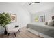 Bright bedroom with a decorative houseplant and a large window offering exterior views at 6755 S Field St # 625, Littleton, CO 80128