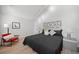 A serene bedroom with a modern bed frame, bedside tables, and cozy decor for relaxation at 6755 S Field St # 625, Littleton, CO 80128