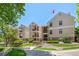 A well-maintained building with stone accents, balconies, and lush landscaping, creating an inviting atmosphere at 6755 S Field St # 625, Littleton, CO 80128
