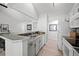 Well-lit kitchen with updated appliances and an open layout providing views of the living area at 6755 S Field St # 625, Littleton, CO 80128