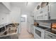 A bright kitchen with stainless steel appliances and granite countertops offers modern convenience at 6755 S Field St # 625, Littleton, CO 80128