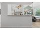 Open kitchen view featuring modern appliances and a connection to the dining area and balcony at 6755 S Field St # 625, Littleton, CO 80128