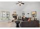 Cozy living room featuring a fireplace, plush seating, and a sliding glass door to a balcony at 6755 S Field St # 625, Littleton, CO 80128