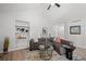 Bright living room showcasing modern decor, built-in shelving, and comfortable seating area at 6755 S Field St # 625, Littleton, CO 80128