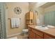 Clean bathroom with single sink vanity and shower/tub combo at 7292 S Blackhawk St # 2-103, Englewood, CO 80112