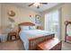 Bright bedroom with wooden bed frame and sliding door to patio at 7292 S Blackhawk St # 2-103, Englewood, CO 80112