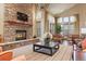 Spacious community room with a stone fireplace and seating area at 7292 S Blackhawk St # 2-103, Englewood, CO 80112
