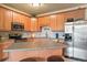 Well-equipped kitchen with stainless steel appliances and ample cabinetry at 7292 S Blackhawk St # 2-103, Englewood, CO 80112