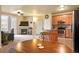 Open living area with kitchen, fireplace, and patio access at 7292 S Blackhawk St # 2-103, Englewood, CO 80112