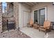 Private patio with seating and gas grill at 7292 S Blackhawk St # 2-103, Englewood, CO 80112