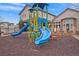 Community playground with slides and climbing structures at 7292 S Blackhawk St # 2-103, Englewood, CO 80112