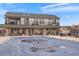 Community pool with a cover and surrounding patio area at 7292 S Blackhawk St # 2-103, Englewood, CO 80112