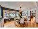 Charming dining area with hardwood floors and a bay window overlooking the yard at 5567 Irish Pat Murphy Dr, Parker, CO 80134