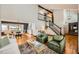 Bright living room with hardwood floors, high ceilings and stairway to second floor at 5567 Irish Pat Murphy Dr, Parker, CO 80134