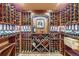 Climate-controlled wine cellar with custom wooden racking and storage for a large wine collection at 5567 Irish Pat Murphy Dr, Parker, CO 80134