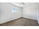 Cozy bedroom with neutral walls, carpet flooring, a ceiling fan, and natural light at 10555 Montview Blvd, Aurora, CO 80010