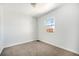 Bedroom with clean, neutral tones and carpeted flooring at 10555 Montview Blvd, Aurora, CO 80010