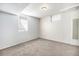 Bright bedroom featuring neutral carpet and paint with window at 10555 Montview Blvd, Aurora, CO 80010